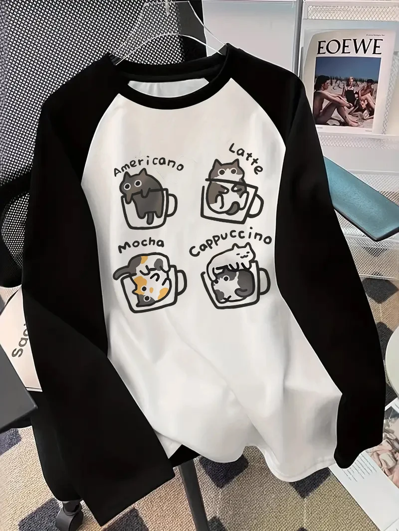 Blouses - コーヒー猫柄の長袖Tシャツ。プリント柄で、ユーモラスなヒップホップ風の90年代スタイル。女性向けのカジュアルなプリント入りクルーネックトップス。